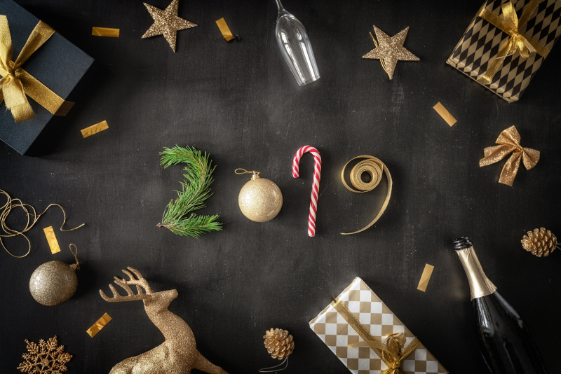 New Year 2019: Baubles and gifts on black desk